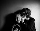 matrix sei black and white photo of kids whispering by kimberly milano