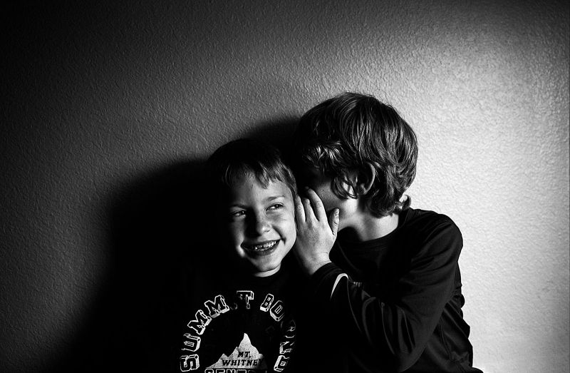 matrix sei black and white photo of kids whispering by kimberly milano